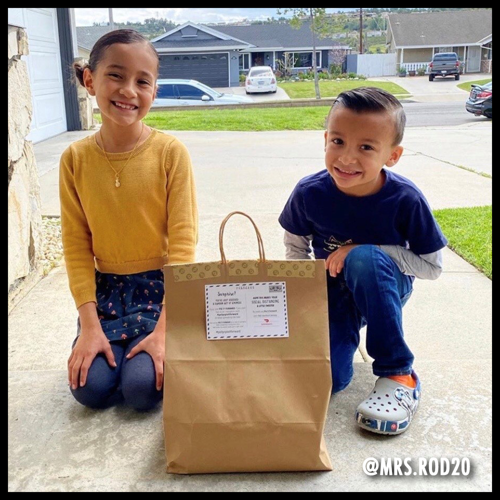 Two kids posing with a Pie-it-forward bag. Image from @mrs.rod20